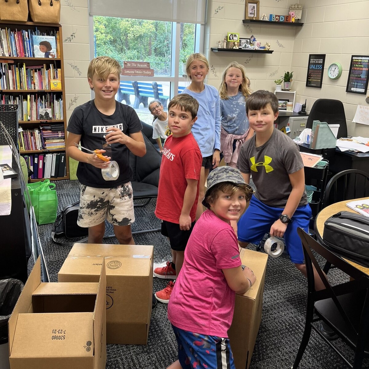 Students packing boxes of donated items